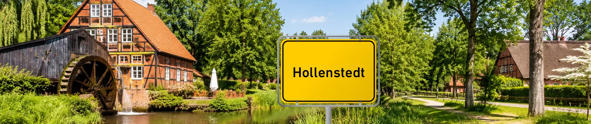Ortsschild von Hollenstedt mit Fachwerkhaus im Hintergrund
